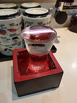 Overflowing sake glass in masu.jpg
