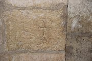 Граффити на церковной стене крест с головой Адама
