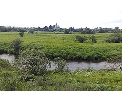 Река Сара и церковь вдали