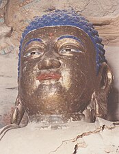 Голова Будды, раскрашенная в синий и золотой цвета