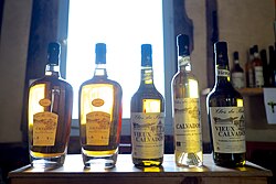 Bottles of Calvados of Clos du Bourg (20249708670).jpg
